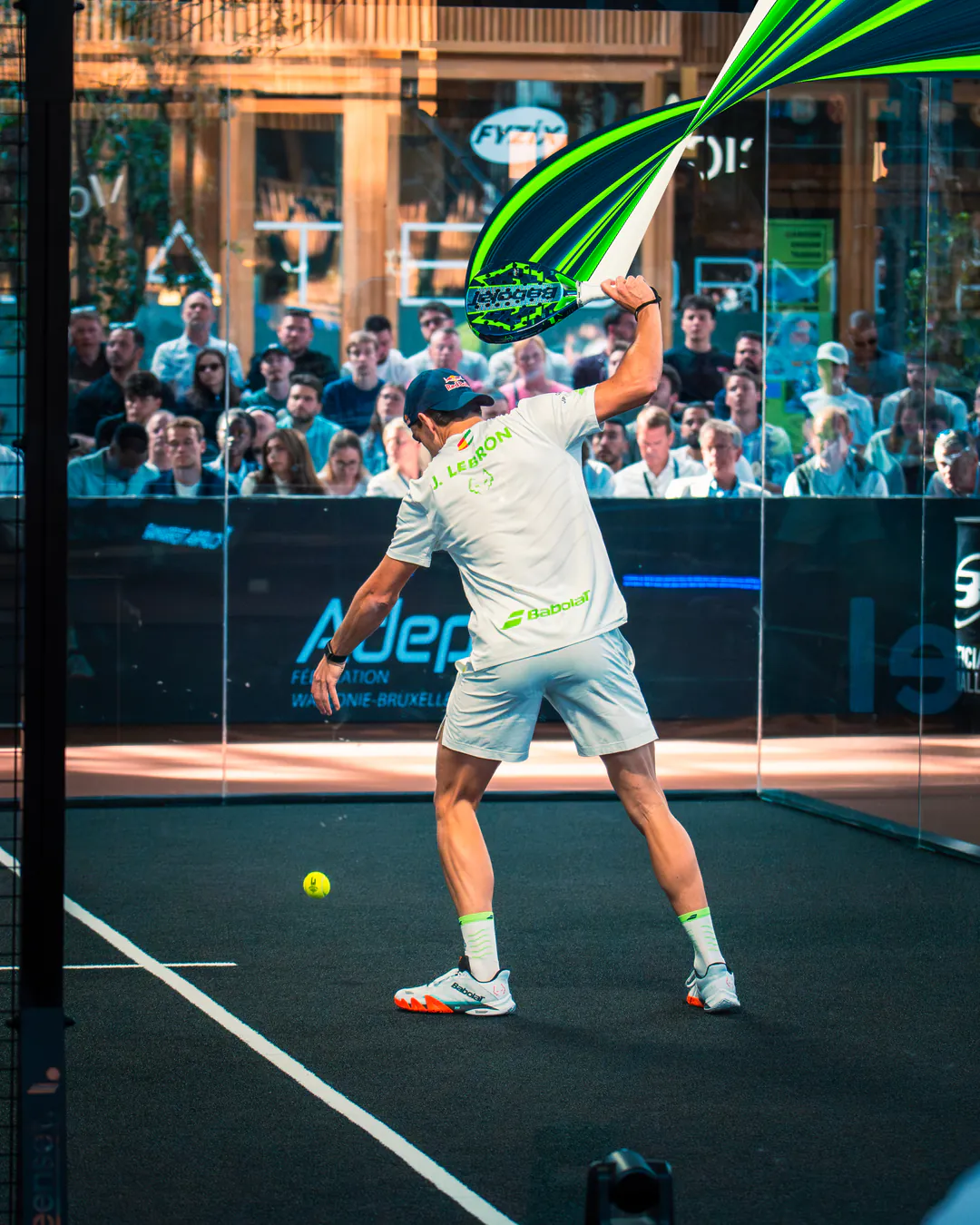 Premier Padel Brussels player preparing to serve