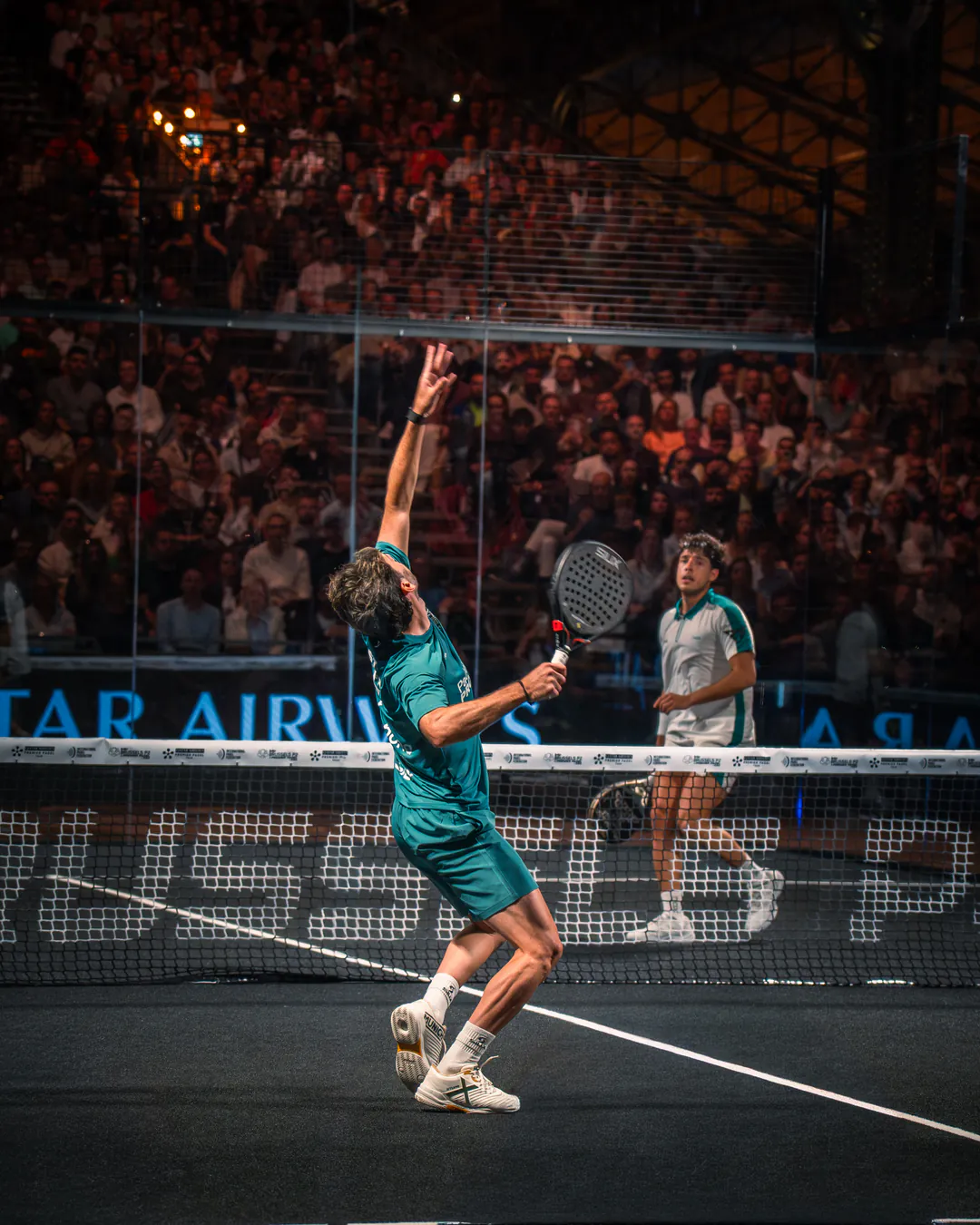 Premier Padel Brussels player returning the ball